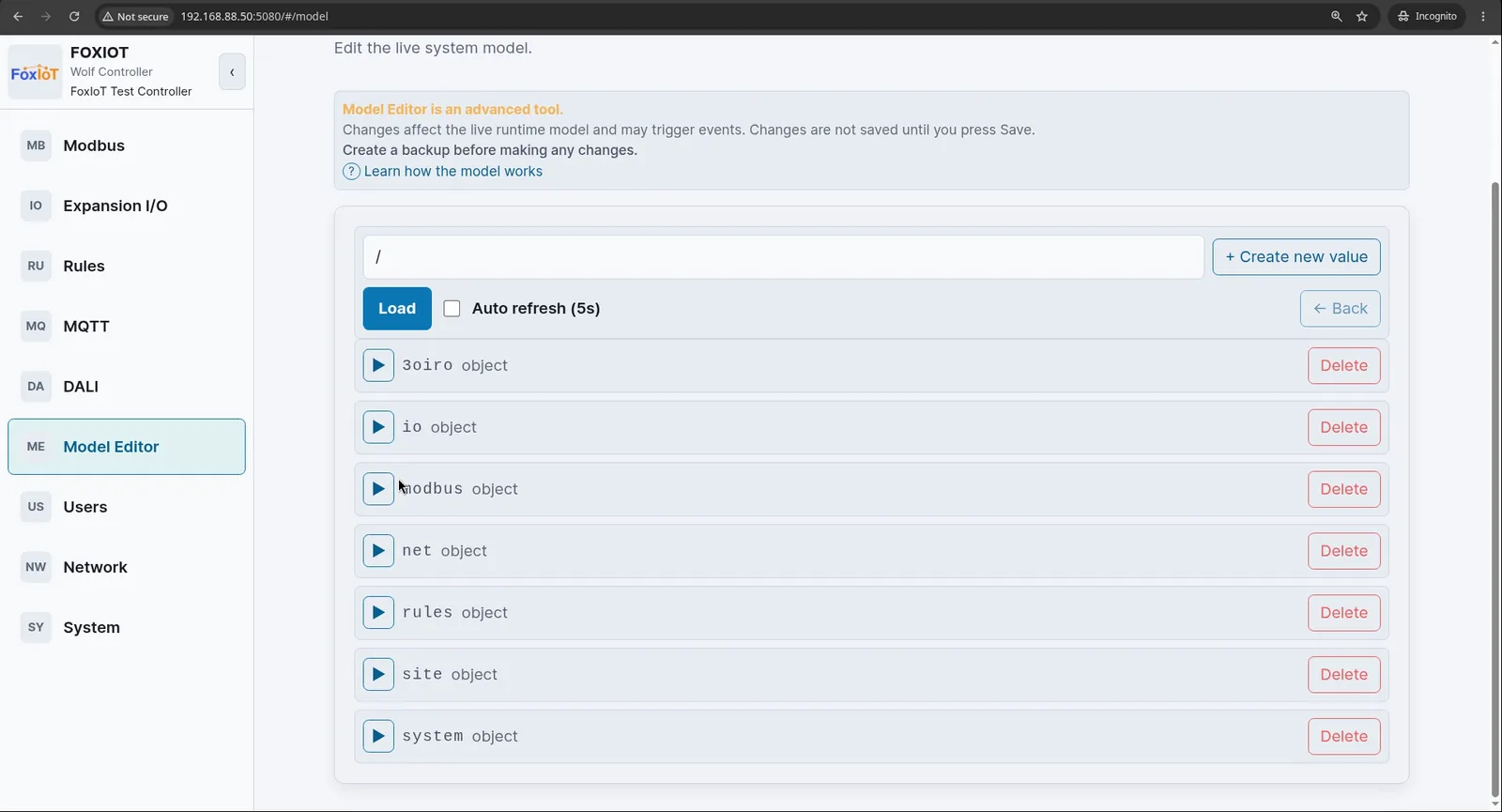 Wolf-App Model Editor showing the top level of the model tree, with the branches 3oiro, io, modbus, net, rules, site and system